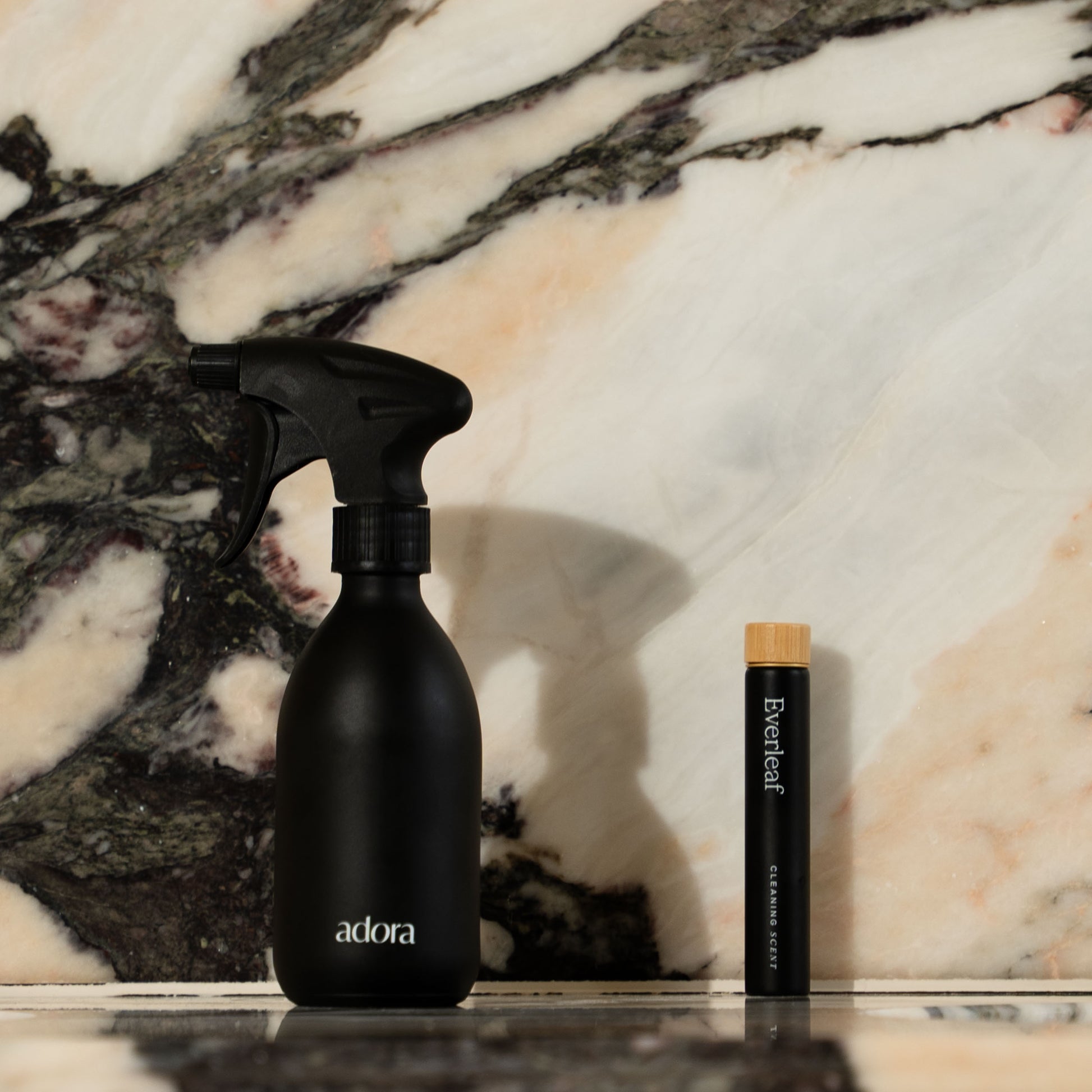 Refillable glass spray bottle filled with Everleaf cleaning scent fresh botanical aroma